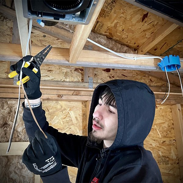 Electrical Tech Student wiring up LLTC Fitness Center